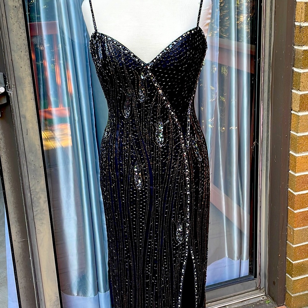 Black gown, size 8 or a sm/med. Covered with black sequins.